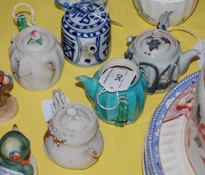 Lot 343 - Five assorted Asian ceramic teapots.