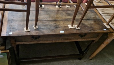 Lot 841 - An antique oak side table, the planked top...