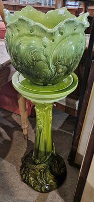 Lot 845 - A Bretby pottery green glazed jardiniere and...