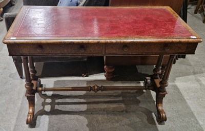 Lot 853 - A Victorian walnut writing table, the...