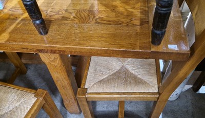 Lot 597 - A modern oak extending dining table, 260 cm...