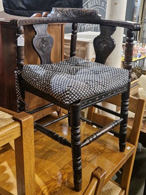 Lot 888 - An antique stained oak corner chair with loose...