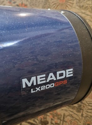 Lot 918 - A Meade LX 200GPS SMT telescope on tripod stand.