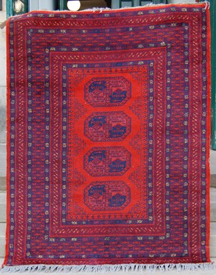 Lot 933 - An Afghan rug, 20th century, the rectangular...