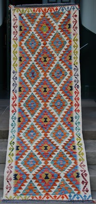 Lot 782 - A Chobi Kilim runner, the ivory coloured...