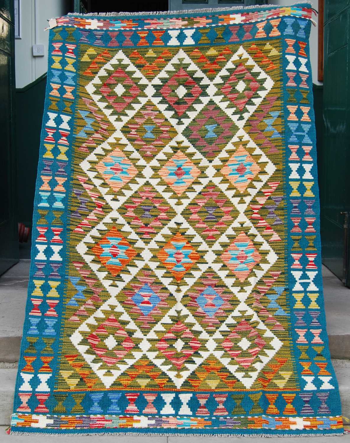 Lot 780 - A Maimana kilim rug, the rectangular green