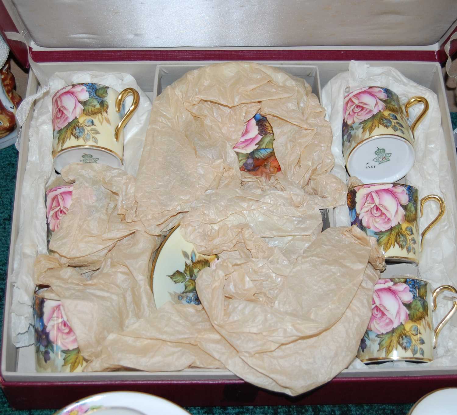 Lot 351 - A boxed Aynsley rose decorated coffee set,...