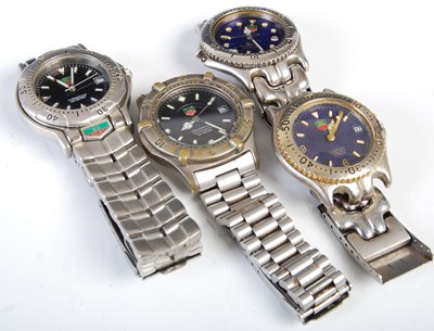 Lot 84E - Four assorted facsimile Tag Heuer wristwatches,...