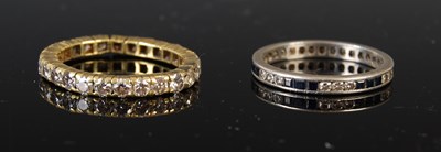 Lot 43E - Two eternity rings to include a yellow metal...