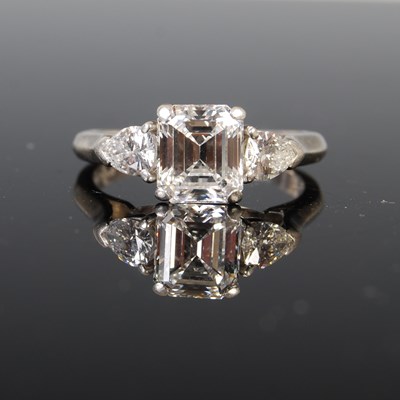 Lot 43 - A white metal and diamond three stone ring,...