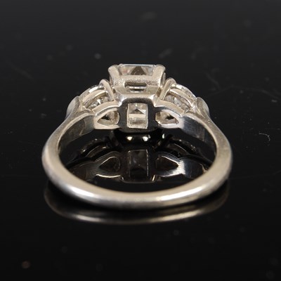 Lot 43 - A white metal and diamond three stone ring,...