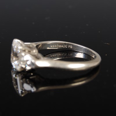 Lot 43 - A white metal and diamond three stone ring,...