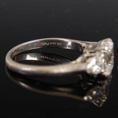 Lot 43 - A white metal and diamond three stone ring,...