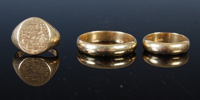 Lot 43L - Three assorted yellow metal rings, all stamped...