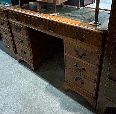 Lot 592 - A reproduction blonde wood pedestal desk with...