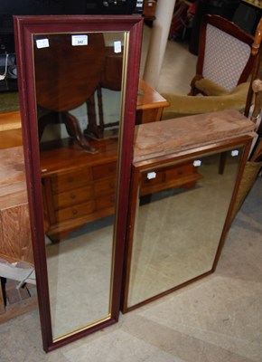 Lot 642 - A stained wood bevelled glass wall mirror...