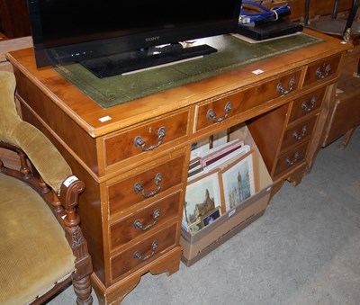 Lot 647 - A reproduction twin pedestal desk with green...