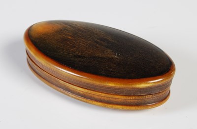 Lot 380 - An early 19th century horn oval snuff box,...