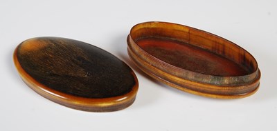 Lot 380 - An early 19th century horn oval snuff box,...