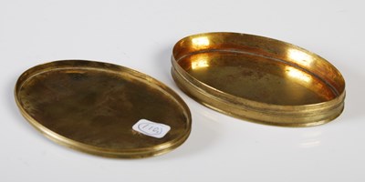 Lot 370 - An early 19th century brass oval snuff box,...