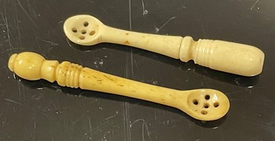 Lot 325 - Two 19th century bone snuff spoons, with...