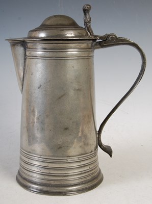 Lot 128 - An early 18th century large pewter flagon of...