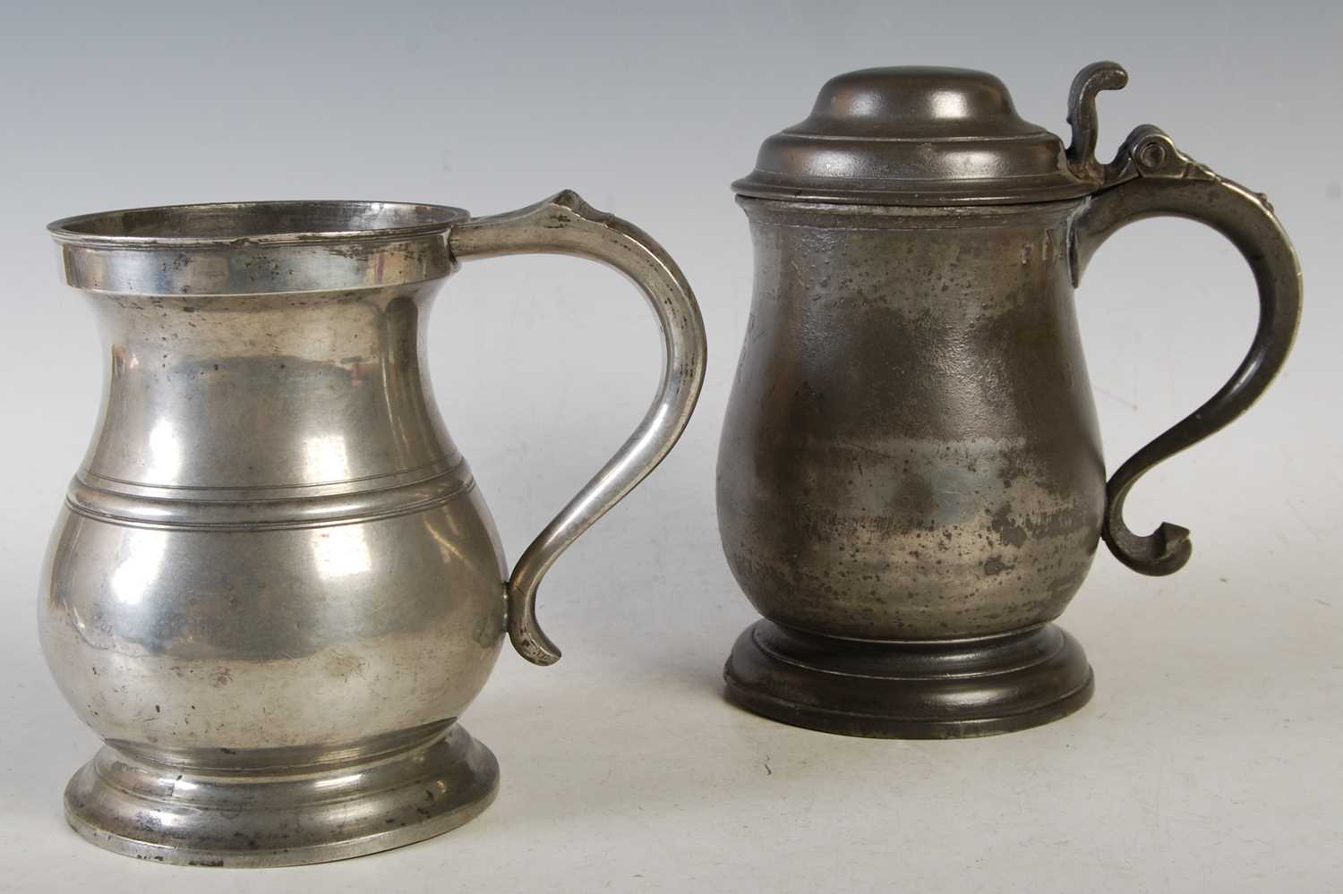 Lot 135 - An 18th century pewter lidded quart tankard...
