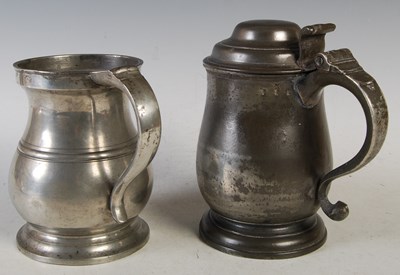 Lot 135 - An 18th century pewter lidded quart tankard...