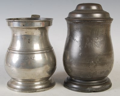 Lot 135 - An 18th century pewter lidded quart tankard...