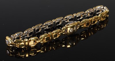 Lot 49 - Chimento, a white and yellow metal bracelet,...