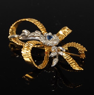 Lot 58 - An 18ct white and yellow gold sapphire and...