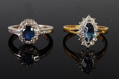 Lot 60 - Two gem set dress rings, one white metal; the...