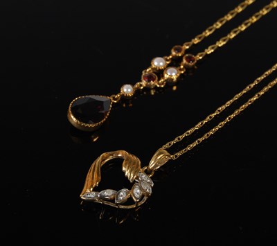 Lot 69 - A 9ct gold heart shaped pendant suspended on...