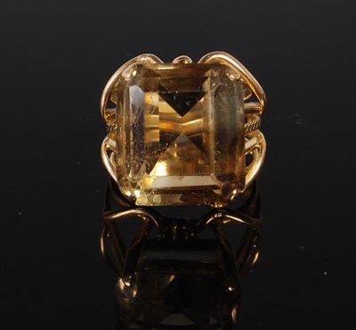 Lot 70 - A yellow metal and smoky quartz single stone...