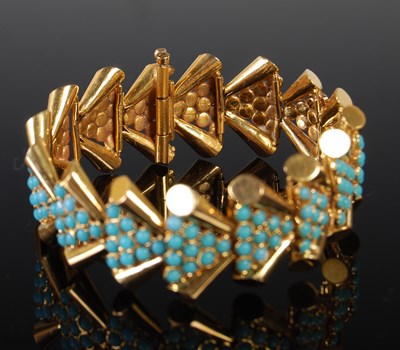 Lot 72 - A yellow metal and turquoise sprung bracelet,...