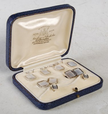 Lot 75 - A cased set of white metal and mother of pearl...