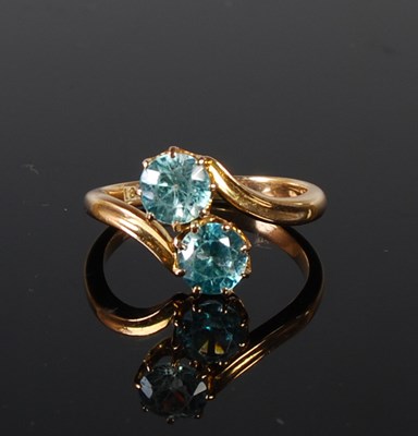 Lot 76 - A yellow metal and blue gem stone two stone...