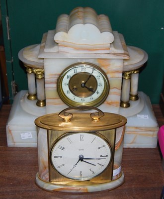 Lot 283 - An early 20th century onyx mantle clock of...