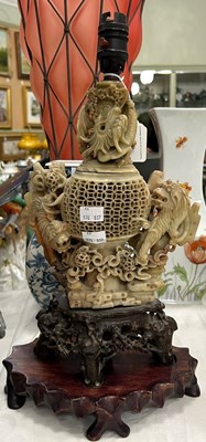 Lot 327 - A Chinese soapstone table lamp and shade, on...