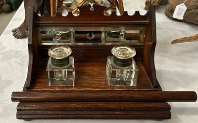 Lot 358 - An oak and mirrored glass desk stand, set with...