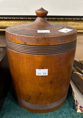 Lot 377 - A turned wood cylindrical storage jar and...