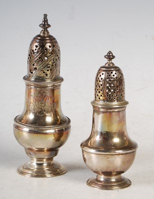 Lot 101 - Two silver sugar casters, 14cm high and 11cm...