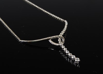 Lot 143 - A white metal and diamond set pendant necklace,...