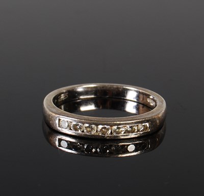 Lot 151 - A 9ct white gold and diamond seven stone ring,...