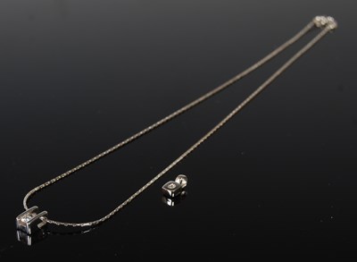 Lot 154 - An 18ct white gold necklace suspending diamond...