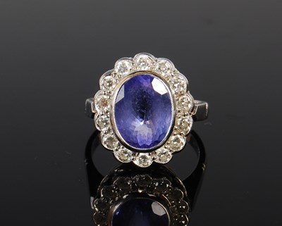 Lot 157 - An 18ct gold diamond and tanzanite cluster...