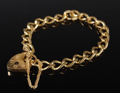 Lot 170 - A 9ct gold bracelet with heart shaped lock, 14....