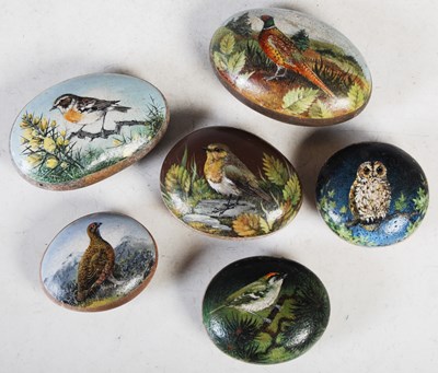 Lot 175 - Six hand-painted stones, decorated by K M Insh,...