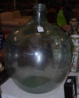 Lot 411 - A green glass carboy jar, 55cm high.