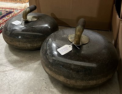 Lot 450A - A pair of curling stones.